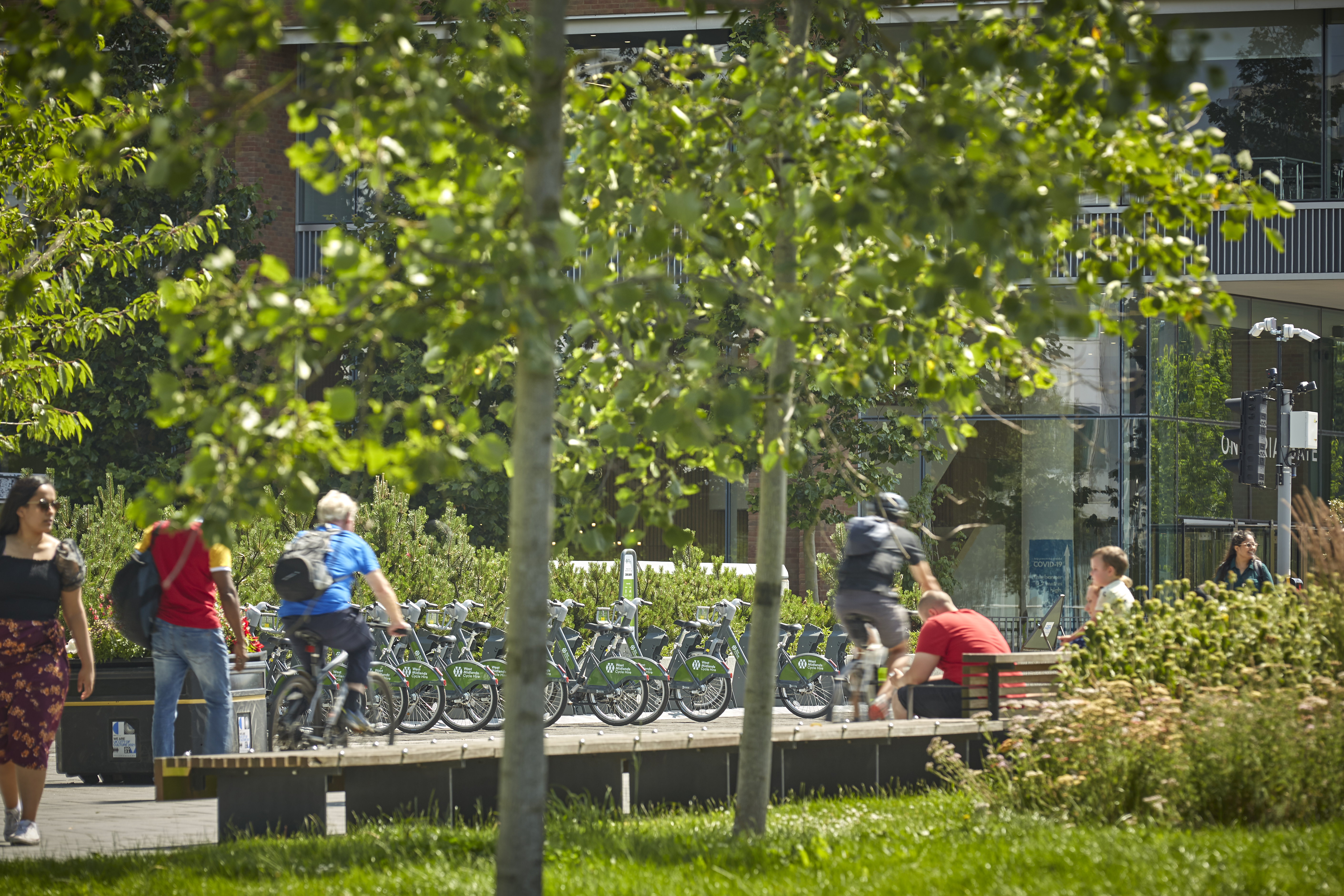 Men biking through Coventry 
